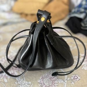 Gucci bag ,  small black draw string  leather pouch